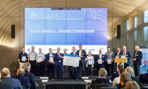 Group photo of all representatives of the ABSOLUT II project holding a funding certificate