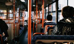 People sitting in a bus - view from the back