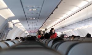 Passengers sitting in an airplane.