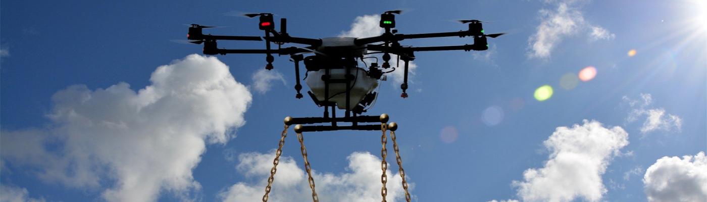 Flying drone with shopping trolley attached below