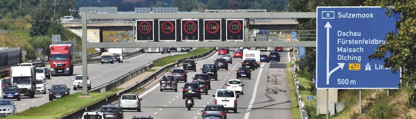 Three-lane motorway, lots of traffic, speed limit 120 on signs